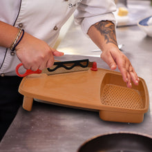 Cutting board with holder for easy chopping and slicing.