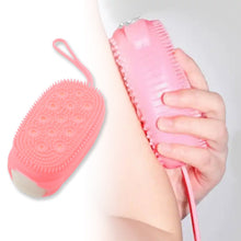 Ultra-soft silicone scrubber brush with dual surfaces for effective body exfoliation.