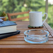 Elegant crystal ashtray with a smooth finish.