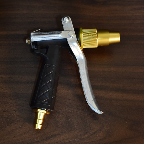 Durable gold trigger nozzle for hoses, lever style for water spraying.